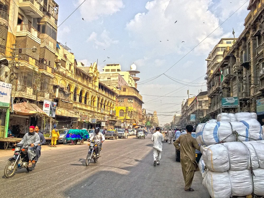 M. A. Jinnah Road Karachi with traffic and commercial buildings